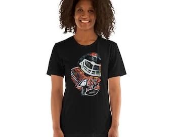 İlker Ortaçによるアメリカンフットボール選手 黒のTシャツ、Bella Canvas 3001