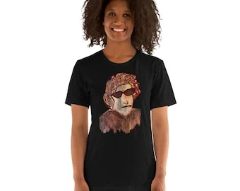 İlker OrtaçによるBob Dylanのサングラスをかけた肖像 黒のTシャツ、Bella Canvas 3001