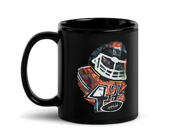 İlker Ortaçによるアメリカンフットボール選手 黒い陶器のマグカップ、11 oz